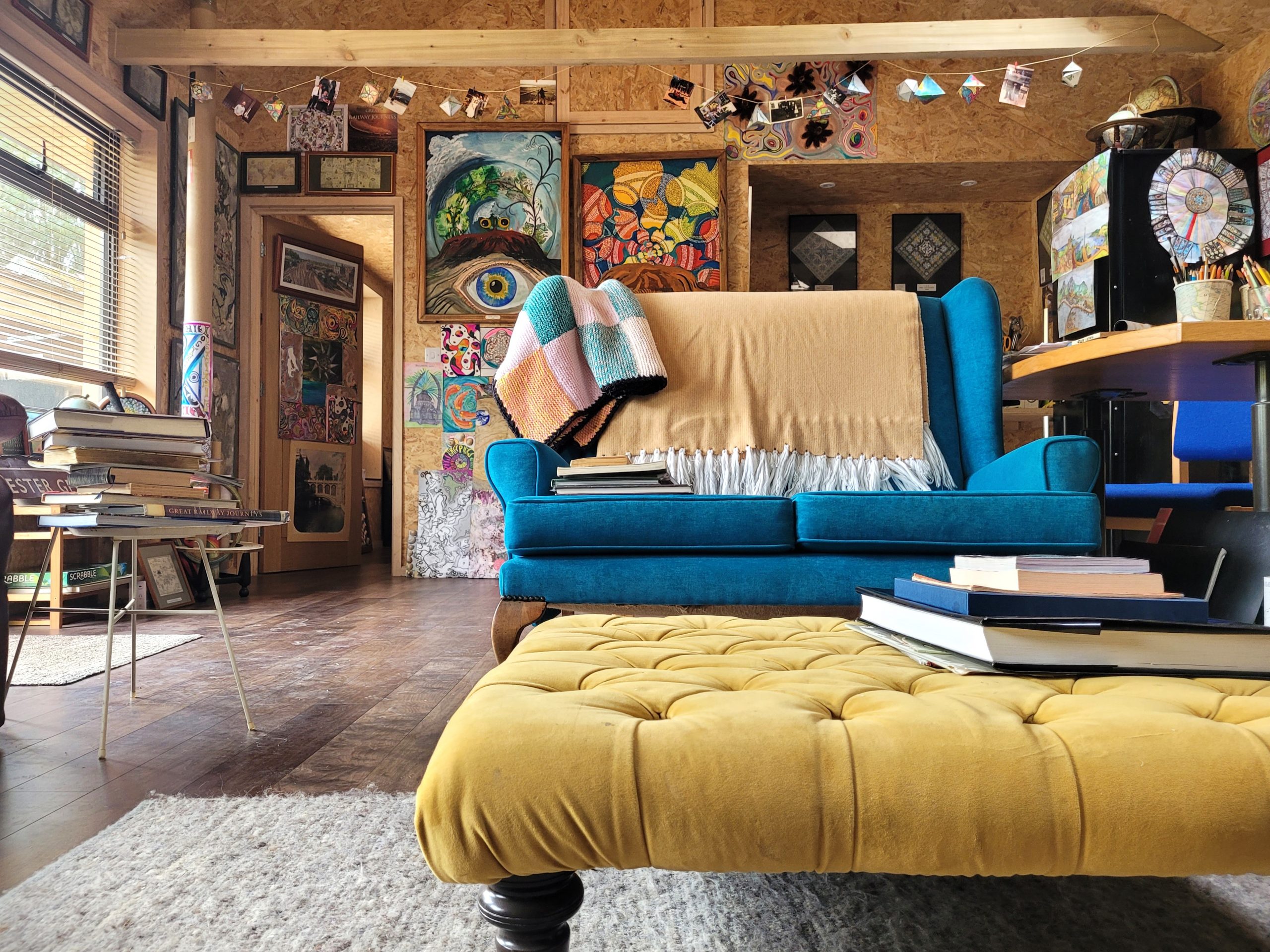 velvet armchair on wooden floor in lounge of annexe